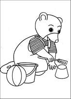 coloriage petit ours brun joue au sable